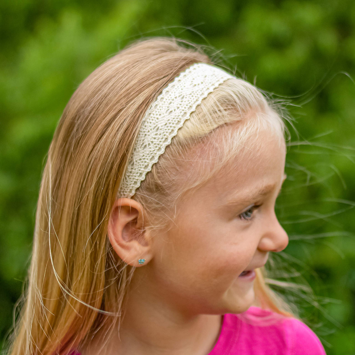FROG SAC close-up of lace ribbon texture illustrating delicate detail and style