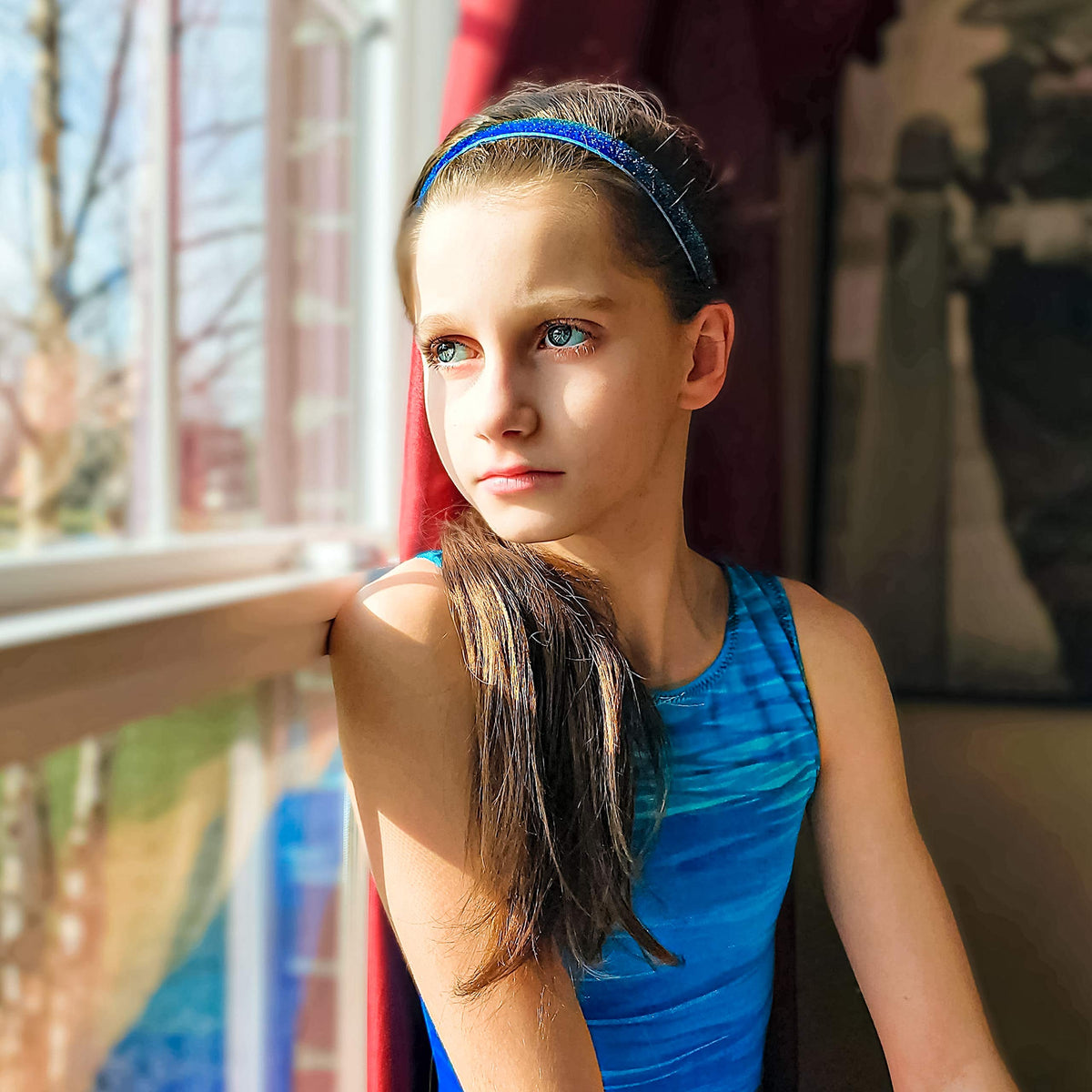 FROG SAC headband worn during gymnastics showing secure hold