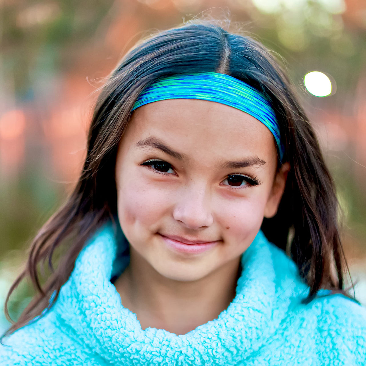 FROG SAC lifestyle image of kids playing outdoors wearing headbands comfortably