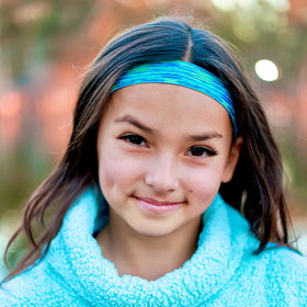 FROG SAC lifestyle image of kids playing outdoors wearing headbands comfortably