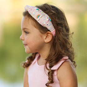 FROG SAC headband on child for size comparison showing true scale and fit benefit