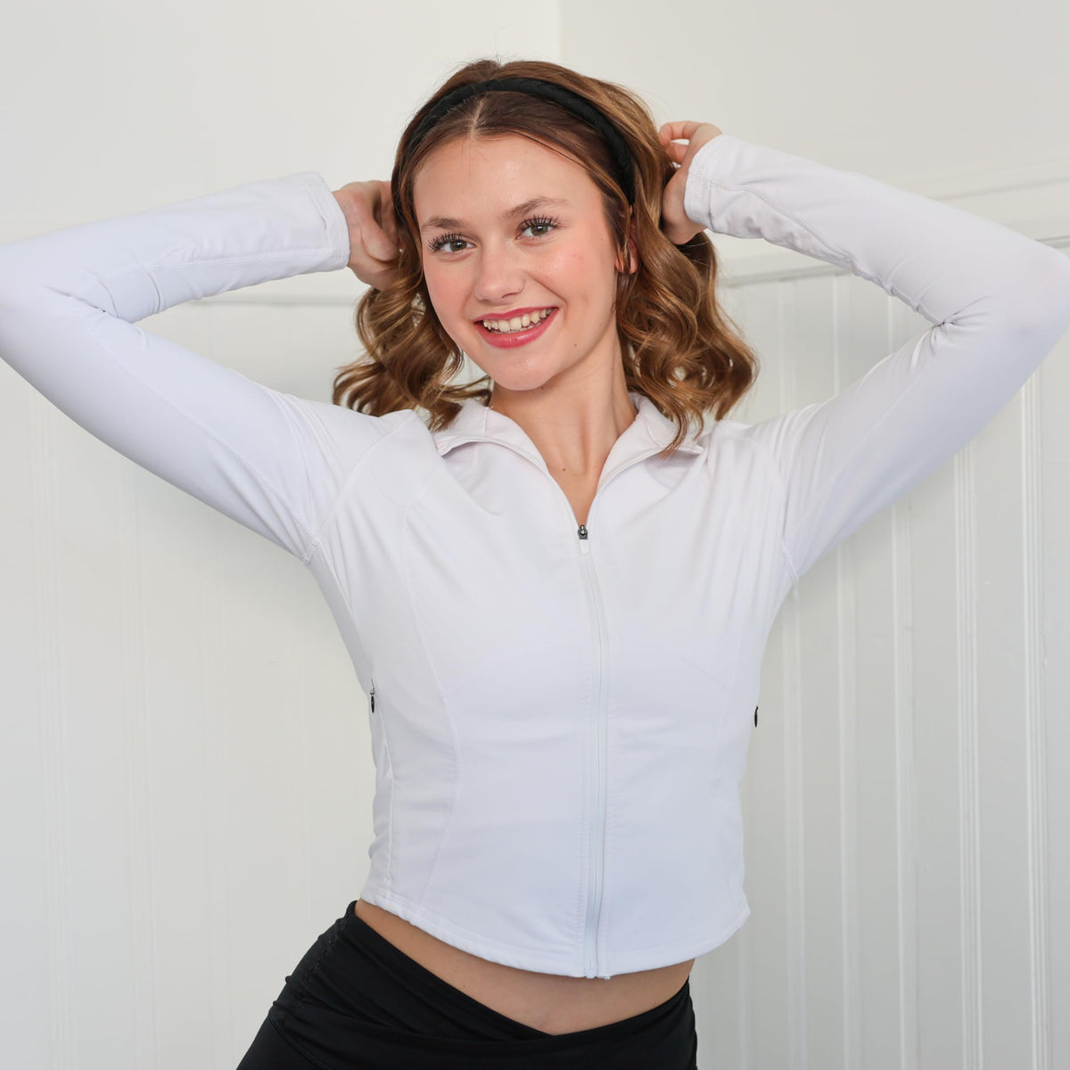 FROG SAC headband in hand to show real size and stretch for easy fitting