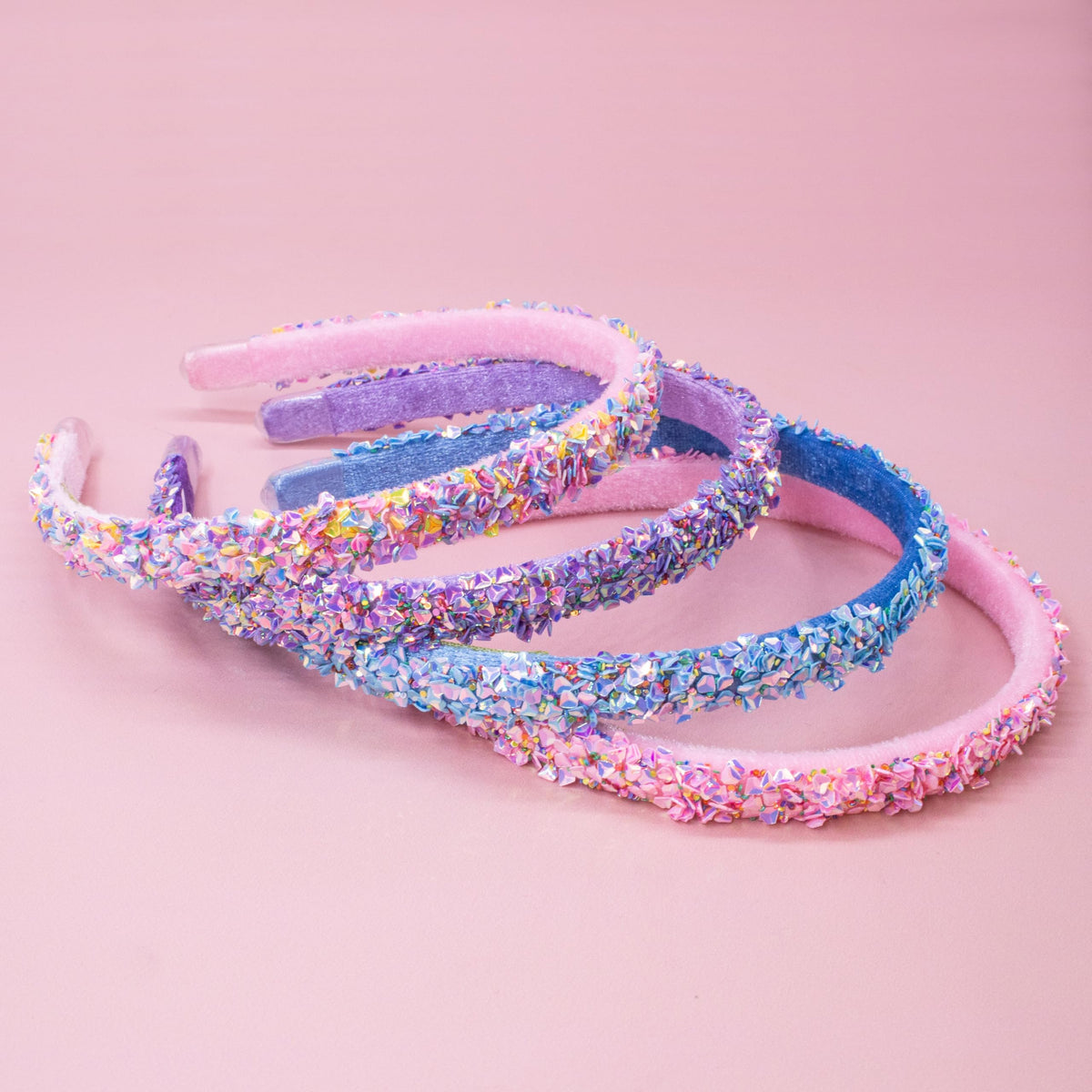 FROG SAC headband in hand showing flexible 13-inch hoop scale benefit