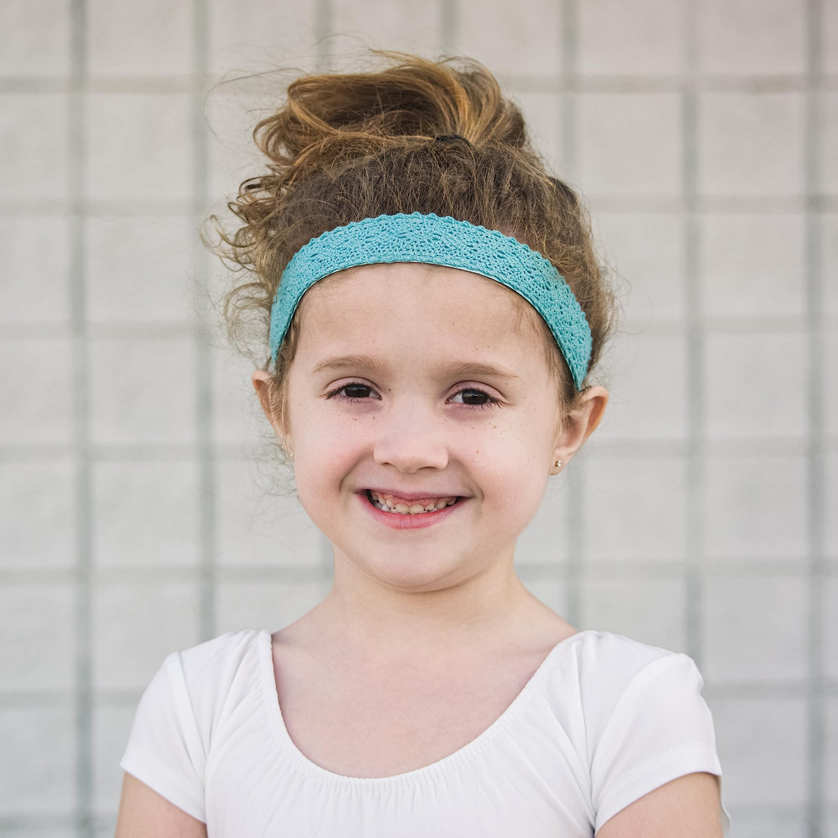 FROG SAC headband beside measuring tape showing suitable head size range