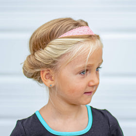 FROG SAC flower girl wearing lace headband as wedding-appropriate accessory