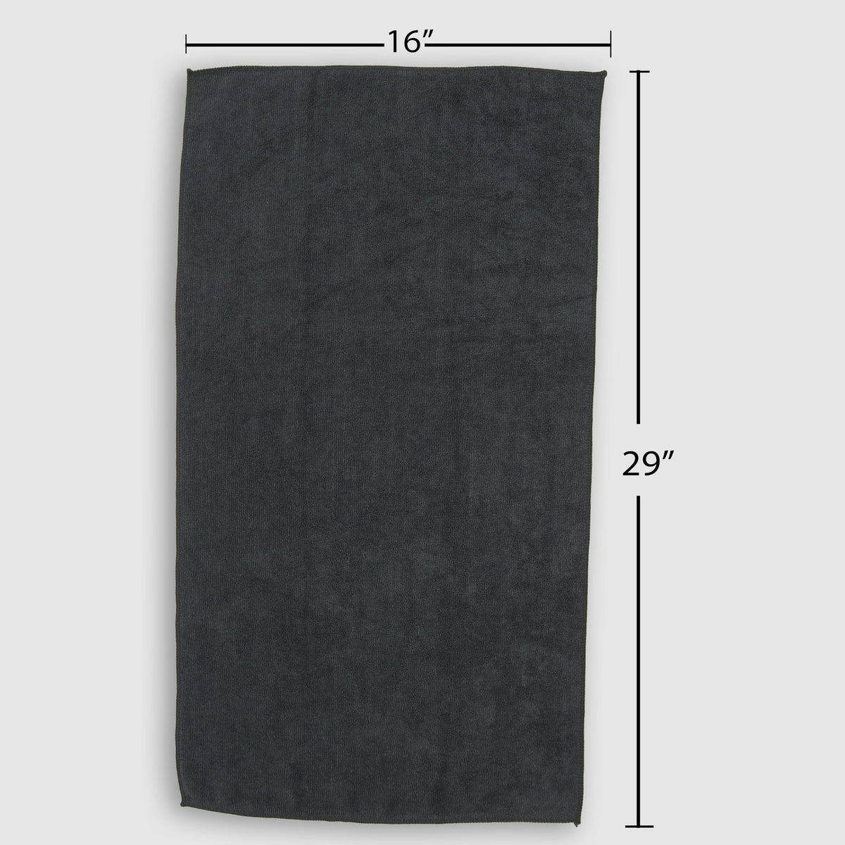 Fromm Softees stacked black towels ready for laundry to indicate durability