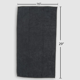 Fromm Softees stacked black towels ready for laundry to indicate durability