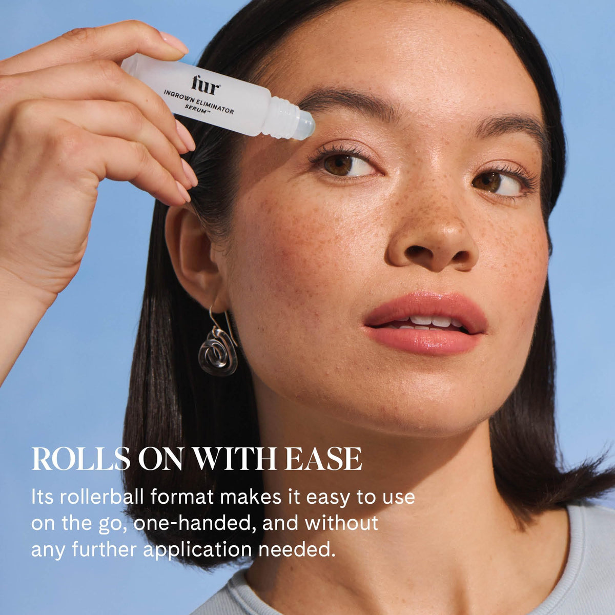 Fur rollerball in hand for size and scale, easy pocket and travel-friendly