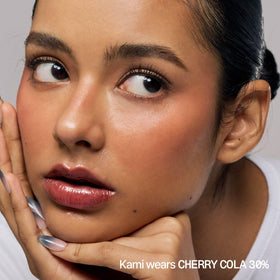 fwee close-up cherry cola sheen demonstrating reflective 3D plumping benefit