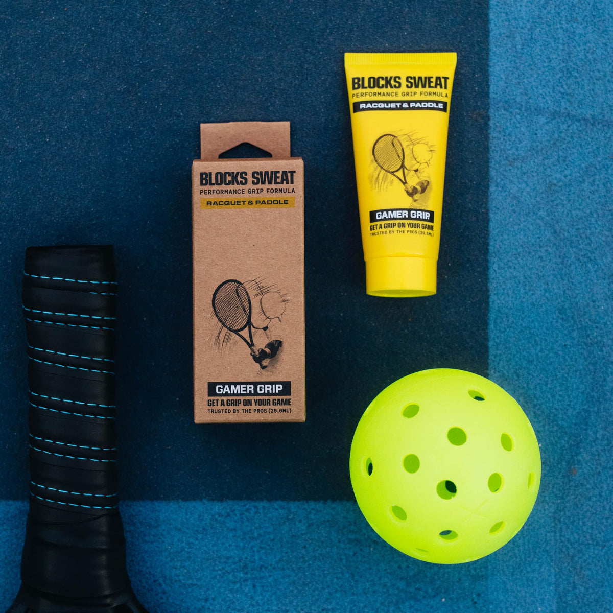 Gamer Grip tube size comparison next to a coin highlighting portable 1oz benefit