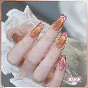 GAOY magnet detail held above a nail demonstrating pigment pull for distinct stripe