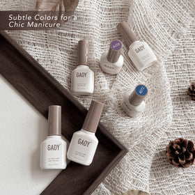 GAOY manicure on hands in cozy setting showing at-home salon results