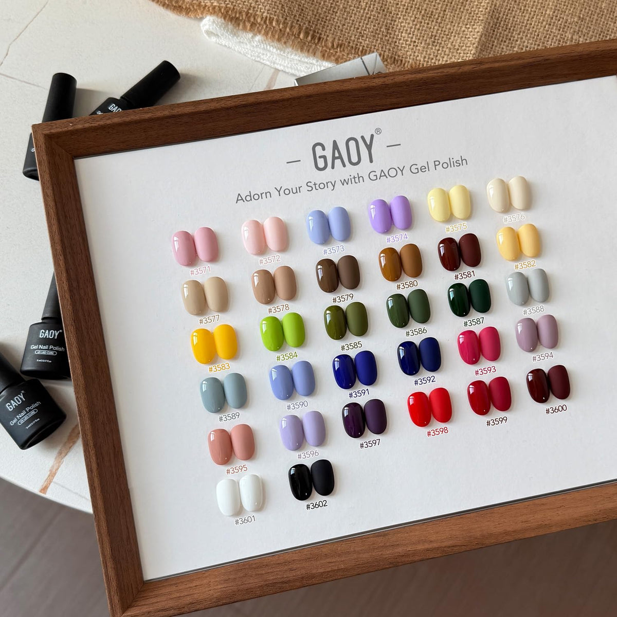 GAOY bottles beside a ruler for scale showing compact sizes and travel-friendly benefit