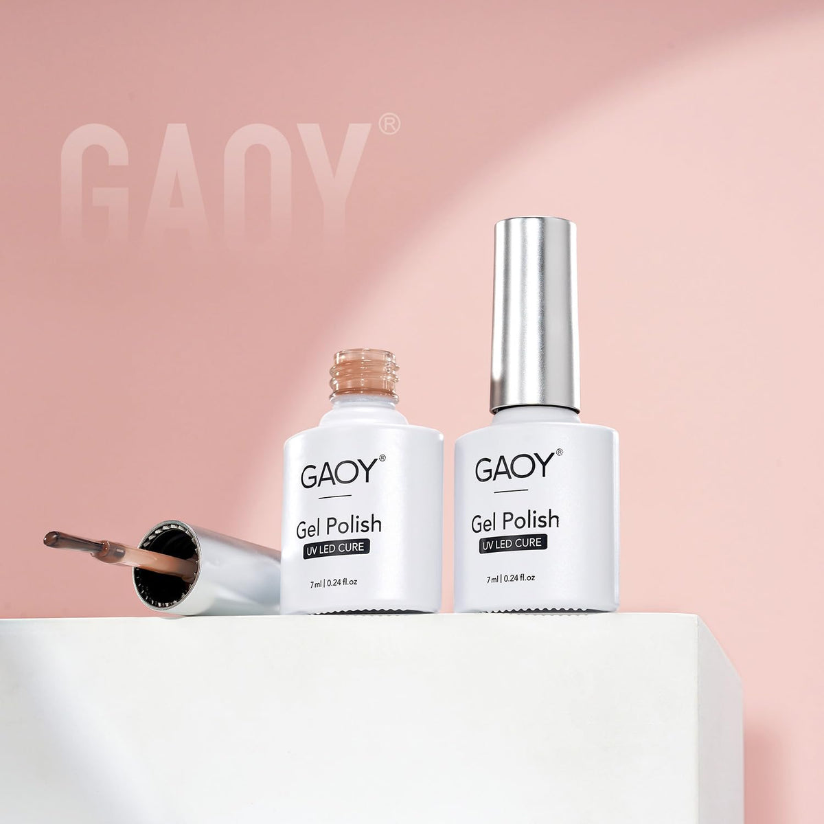 GAOY bottles beside a coin showing 7ml size for travel-friendly, economical use