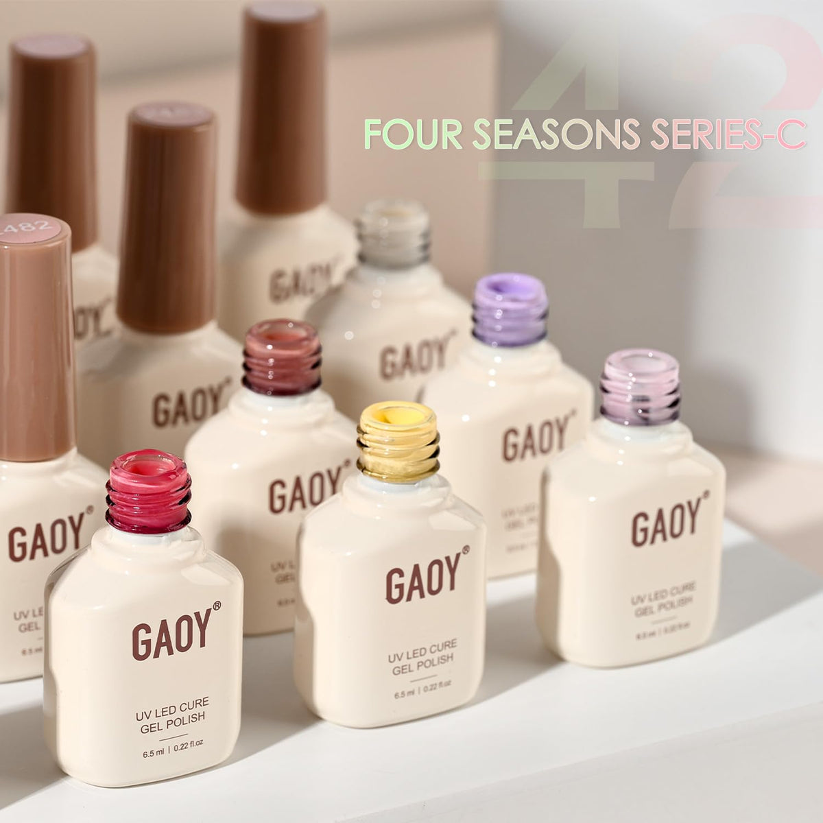 GAOY size comparison hand next to bottles illustrating compact 6.5ml bottles for multiple uses