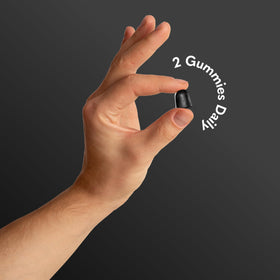 Garden of Life gummy in hand demonstrating size and portability for travel convenience