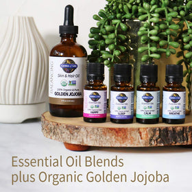 Garden of Life jojoba oil next to ruler showing 4 fl oz size for scale