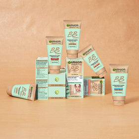 Garnier 50 ml tube next to ruler showing compact travel size