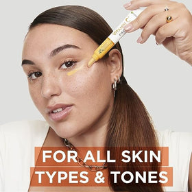 Garnier eye cream next to a ruler displaying 15ml size for travel convenience