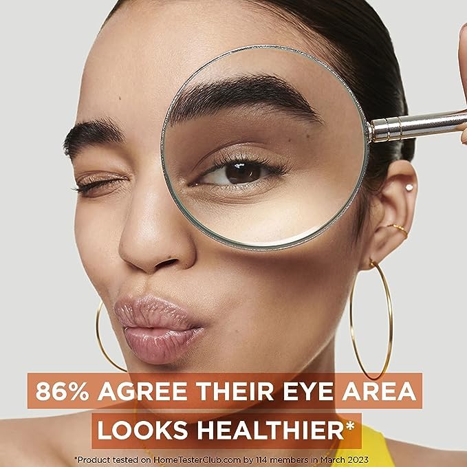 Garnier eye cream application under-eye patting showing reduced puffiness benefit