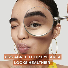Garnier eye cream application under-eye patting showing reduced puffiness benefit
