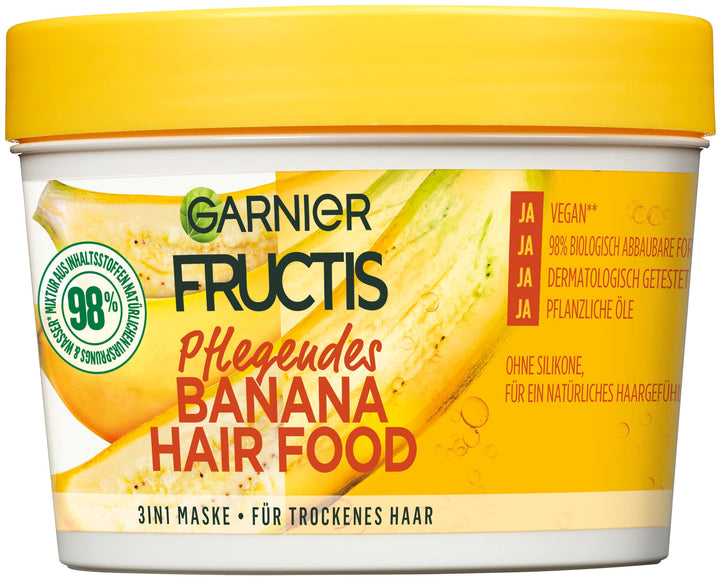 Garnier Fructis front packaging showing 390 ml tub and banana graphics, highlights nourishing benefit