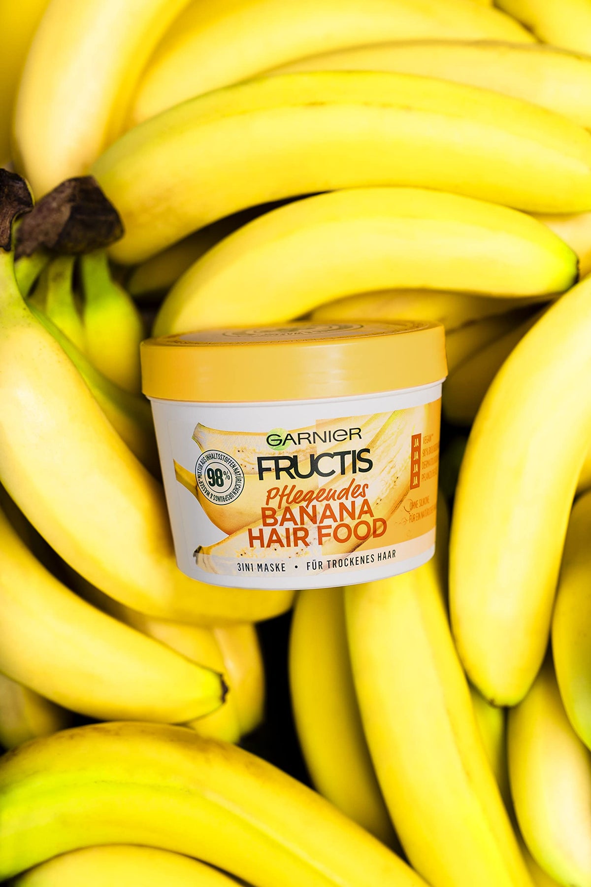 Garnier Fructis applied to damp hair demonstrating nourishment and improved manageability during styling