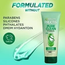 Garnier Fructis applied to damp hair demonstrating controlled styling benefit