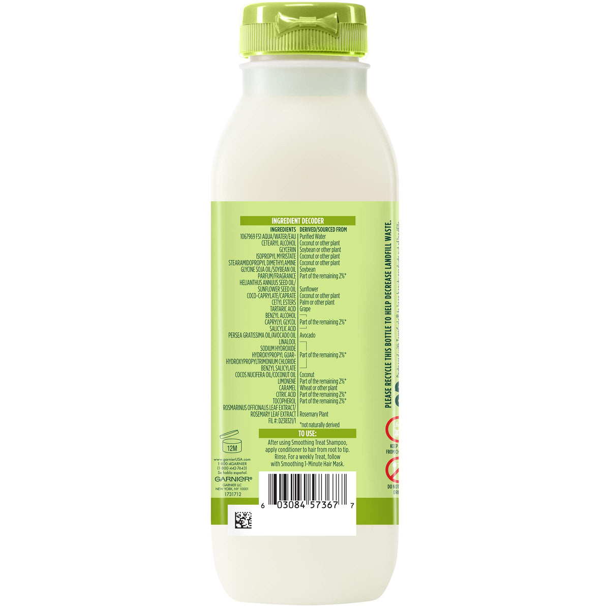 Garnier Fructis bottle held in hand showing size and travel convenience