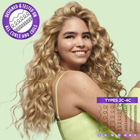 Garnier Fructis size comparison with hand showing product scale