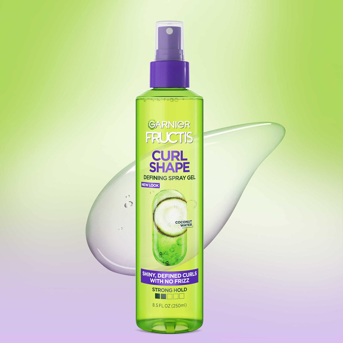 Garnier Fructis spray-gel mist in hand illustrating lightweight texture and control