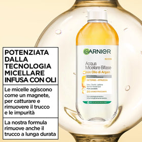 Garnier two-phase bottle being shaken to mix micellar water and argan oil for effective cleansing