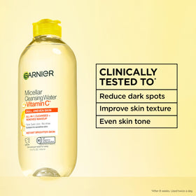 Garnier micellar water poured onto cotton pad for fast makeup removal