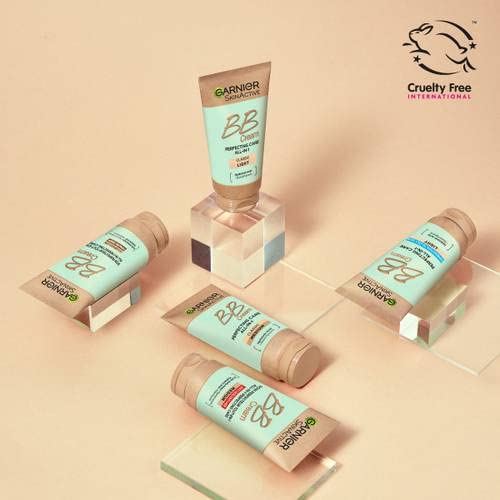 Garnier medium shade swatched on hand for shade match and buildable coverage