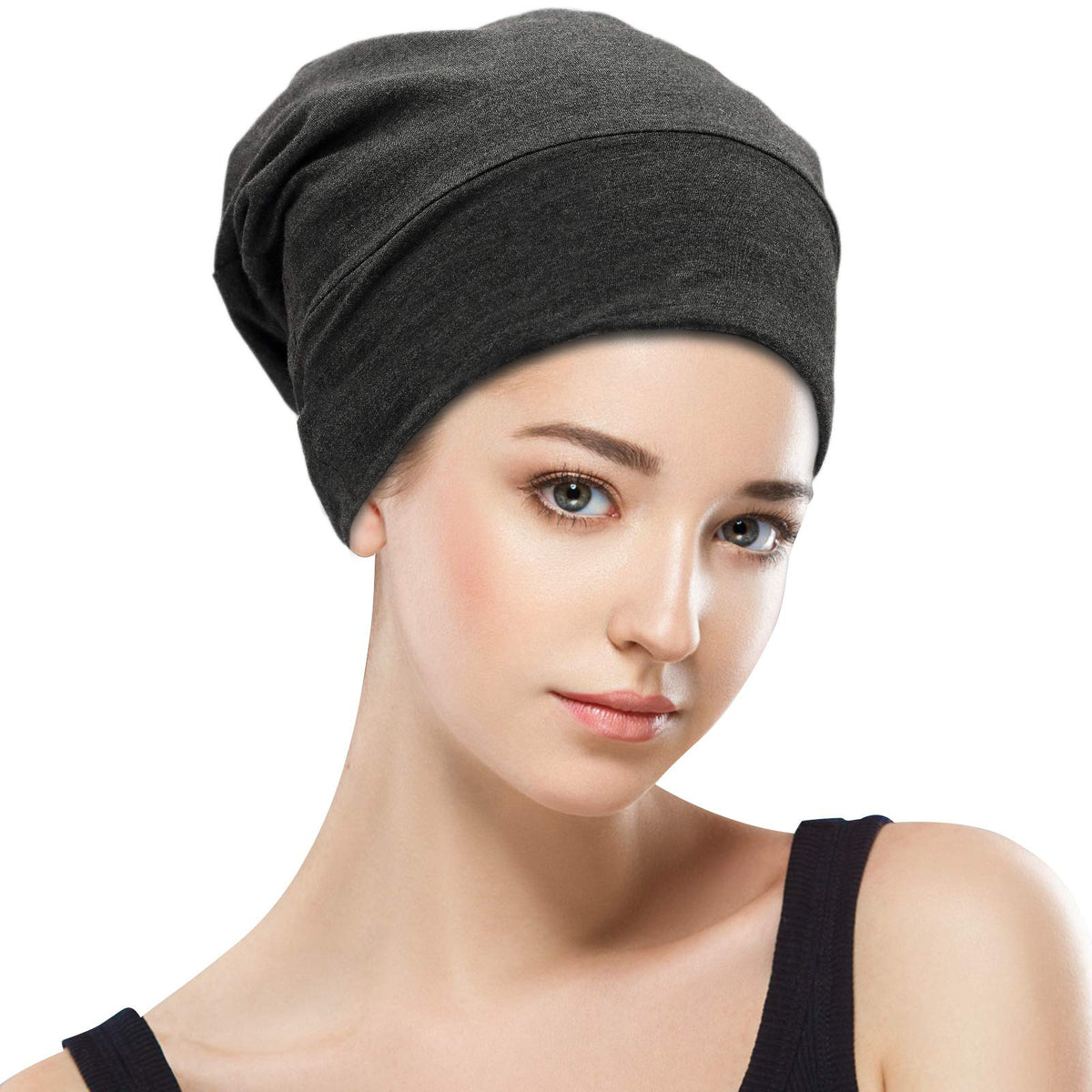 GB Selected bonnet on pillow in bedroom setting illustrating overnight hair protection benefit
