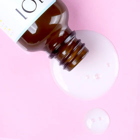 Geek & Gorgeous bottle on bathroom vanity in lifestyle setting suggesting daily routine use