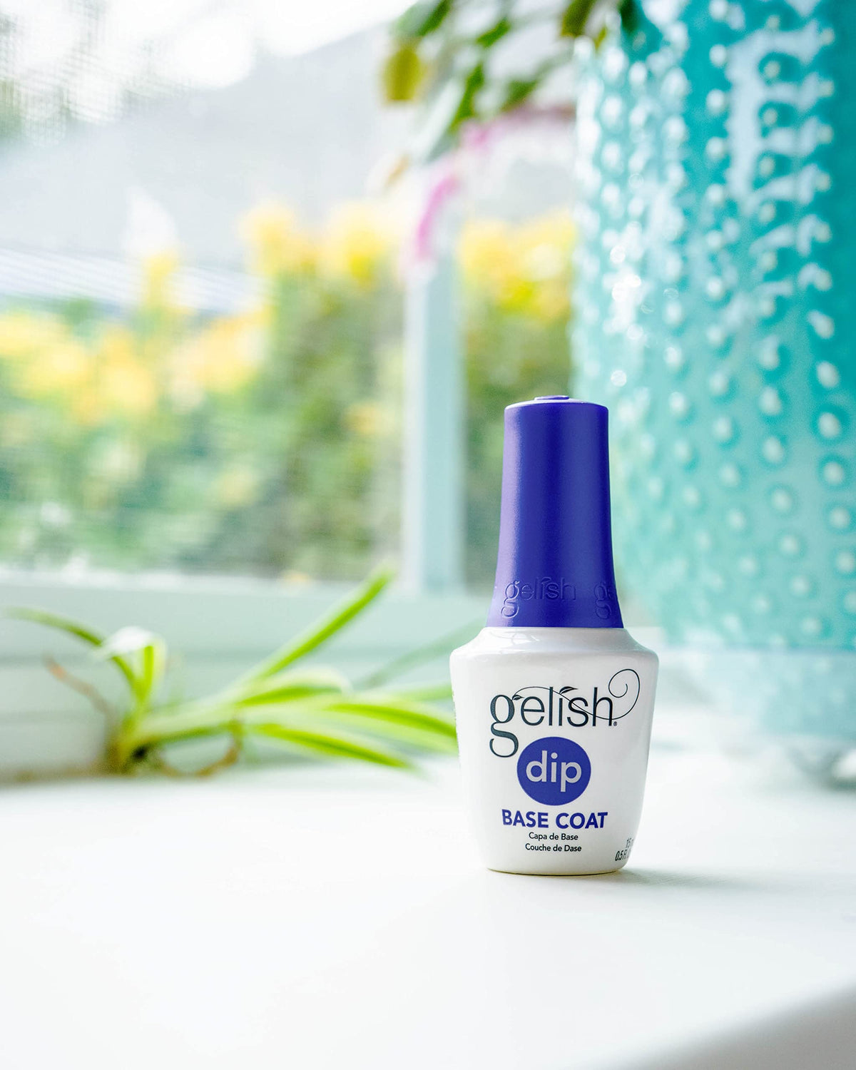 Gelish Activator spray action over dipped nail layers for quick hardening benefit