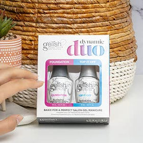 Gelish bottles held in hand for scale demonstrating ergonomic cap for easier handling