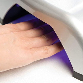 Gelish Harmony being applied in salon demonstrating secure adhesion benefit
