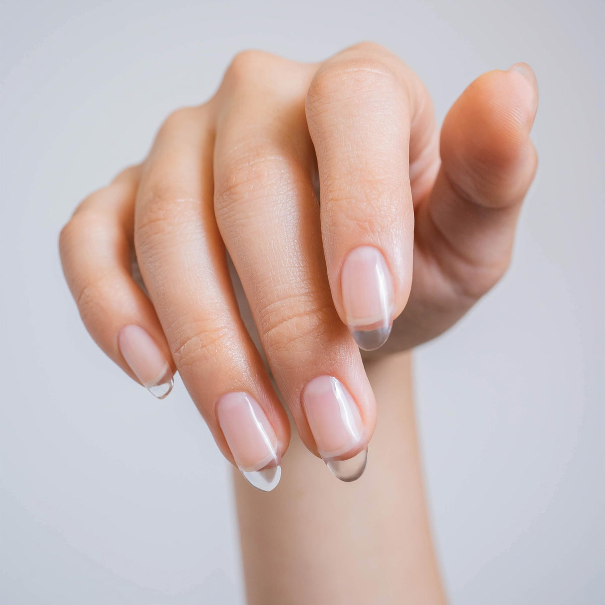 Gelish nail extension in use on a technician creating durable, lightweight tips