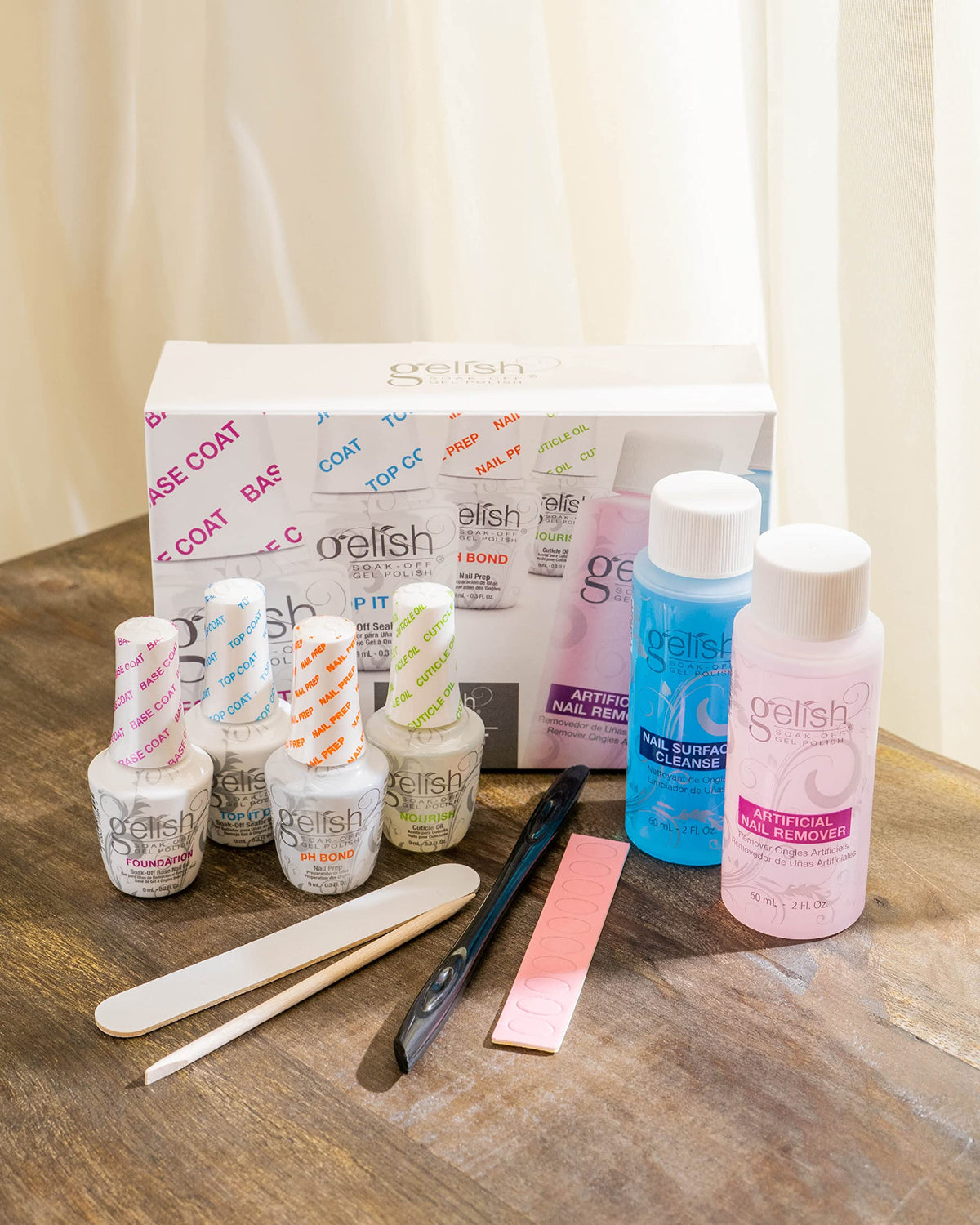 Hand applying Gelish Nourish to cuticle demonstrating hydration and healthier-looking skin