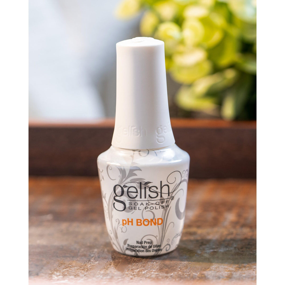 Gelish pH Bond size comparison with hand showing bottle scale and convenience for multiple manicures
