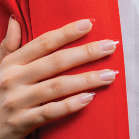 Gelish size scale bottle in hand showing 15 mL capacity for salon use