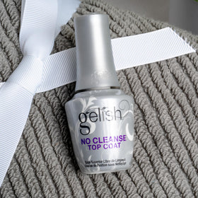 Gelish top coat curing in salon lamp showing fast, no-wipe convenience benefit