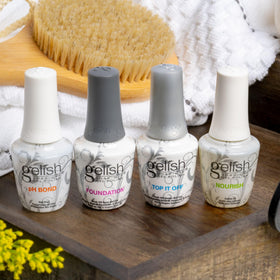 Gelish Top It Off cured high-gloss finish on nail tip providing chip-resistant shine