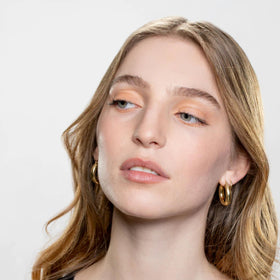 GEN SEE flatlay with Melon among brushes for creative makeup routines
