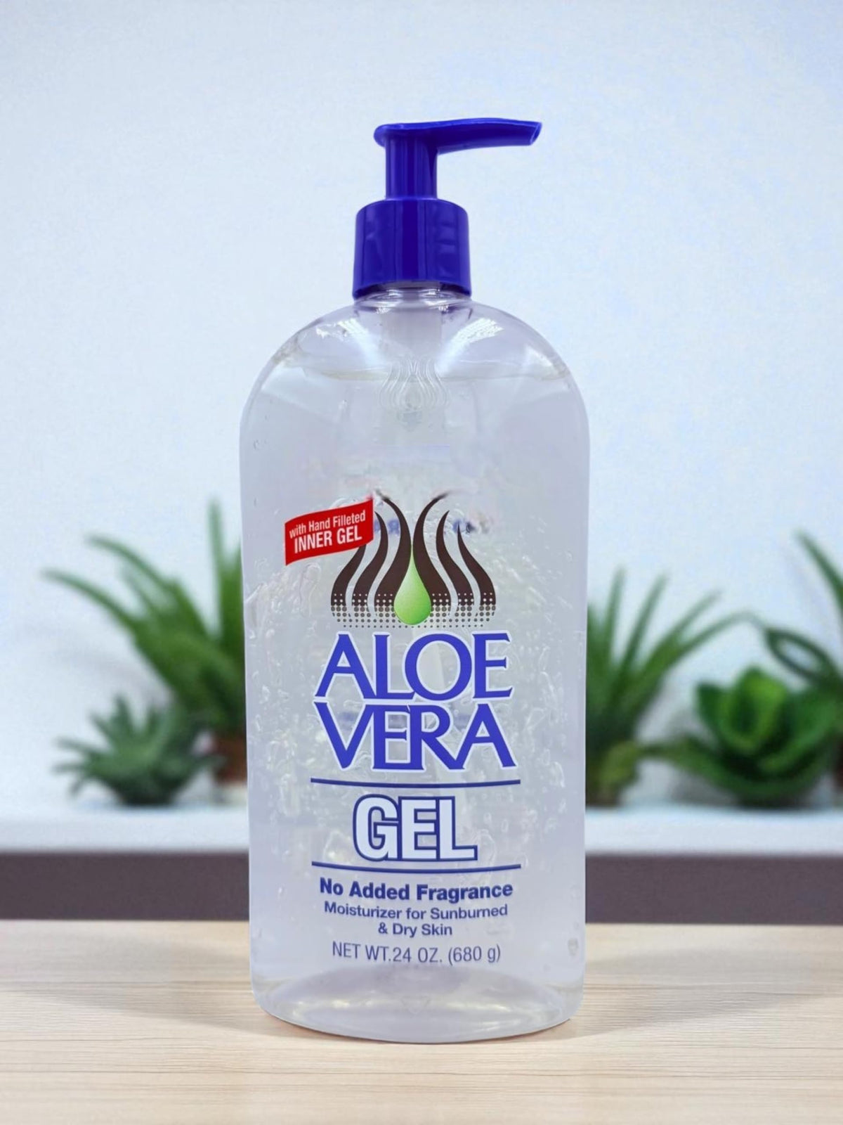 Generic aloe vera next to a hand for size comparison showing large 24 oz supply and value