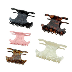 Generic front view of five acetate butterfly clips showing color variety and polished finish for stylish hold
