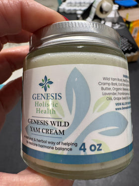 Genesis Holistic Health applying cream to abdomen for localized comfort and hydration