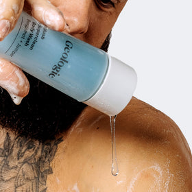 Geologie in-shower lifestyle photo showing hydrated skin and refreshing bergamot scent